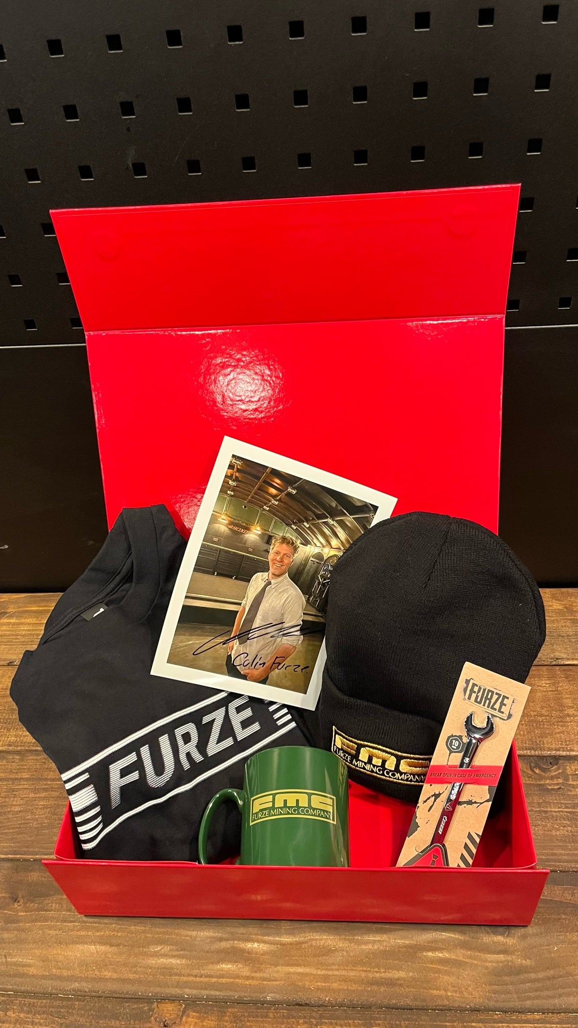 FMC Bundle contents: Furze T-shirt, signed Colin Furze photo, FMC beanie, mug and 10mm spanner