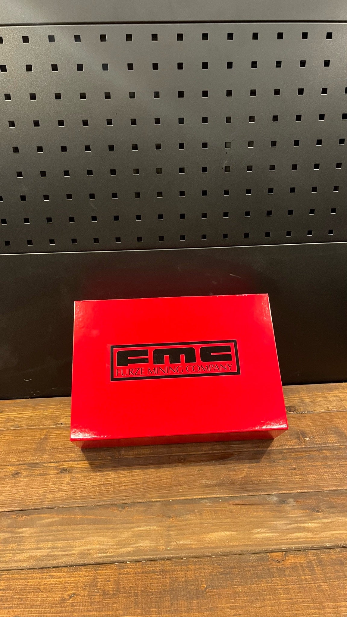 Closed red Furze Mining Company gift box