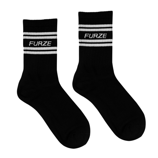 Black socks with white stripes and 'FURZE' branding on